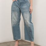Model is wearing Good Luck Barrel Jeans in Washed Denim - front view - relaxed pose