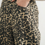 Close up front waist and pocket details of Woman wearing Good Luck Barrel Jeans in Leopard 
