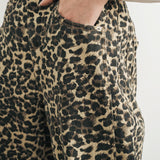 Close up front waist and pocket details of Woman wearing Good Luck Barrel Jeans in Leopard 