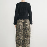Woman wearing Good Luck Barrel Jeans in Leopard and black sweater - back view