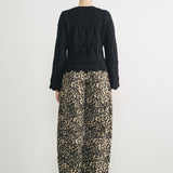 Woman wearing Good Luck Barrel Jeans in Leopard and black sweater - back view