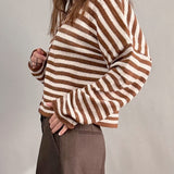 Side view of Hailey Button Down Cardigan in Ivory Brown Stripe paired with brown shorts, relaxed everyday outfit