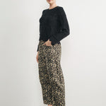 Woman wearing Good Luck Barrel Jeans in Leopard and black sweater - side view