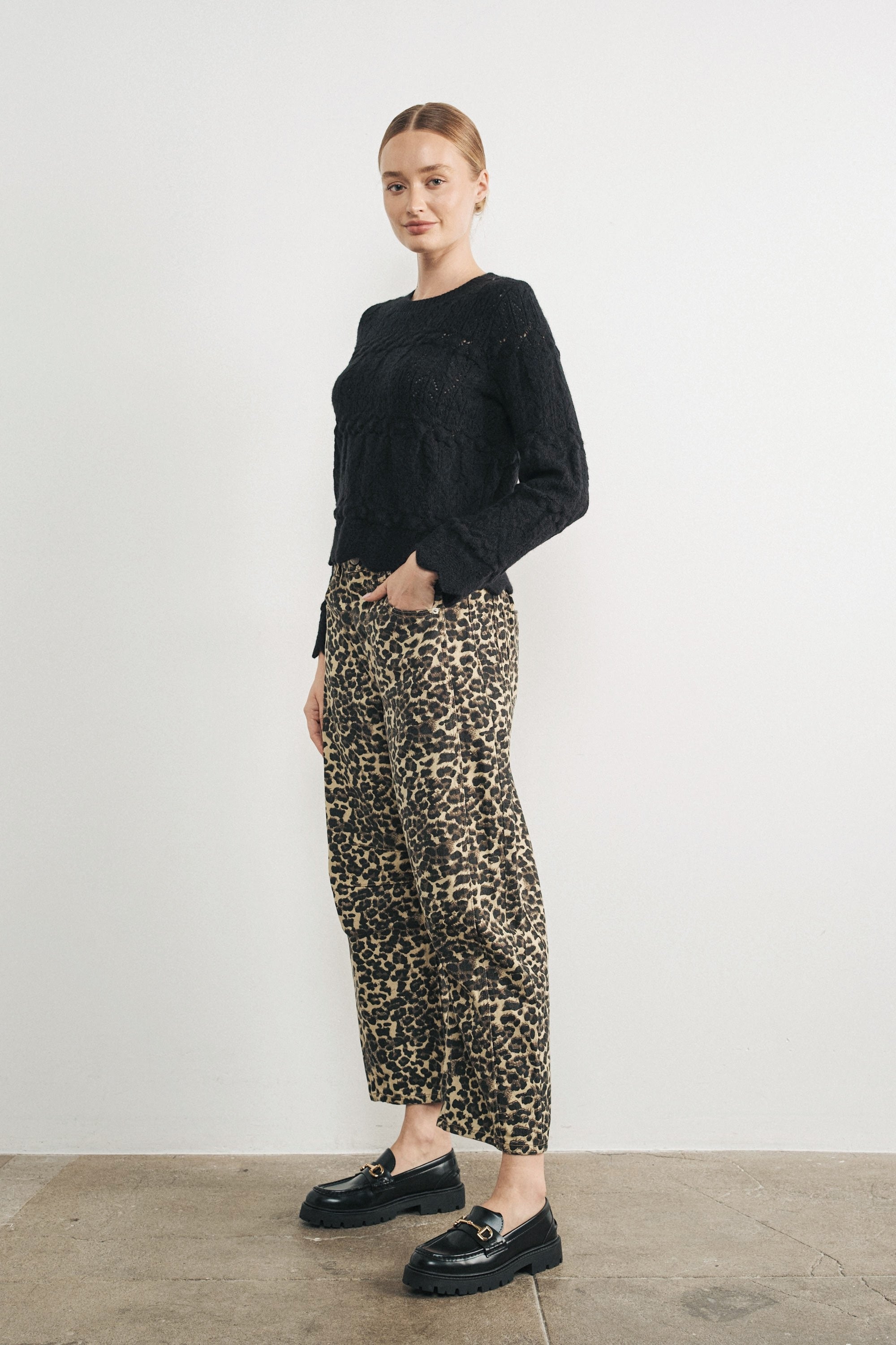 Woman wearing Good Luck Barrel Jeans in Leopard and black sweater - side view