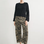 Woman wearing Good Luck Barrel Jeans in Leopard and black sweater - front view