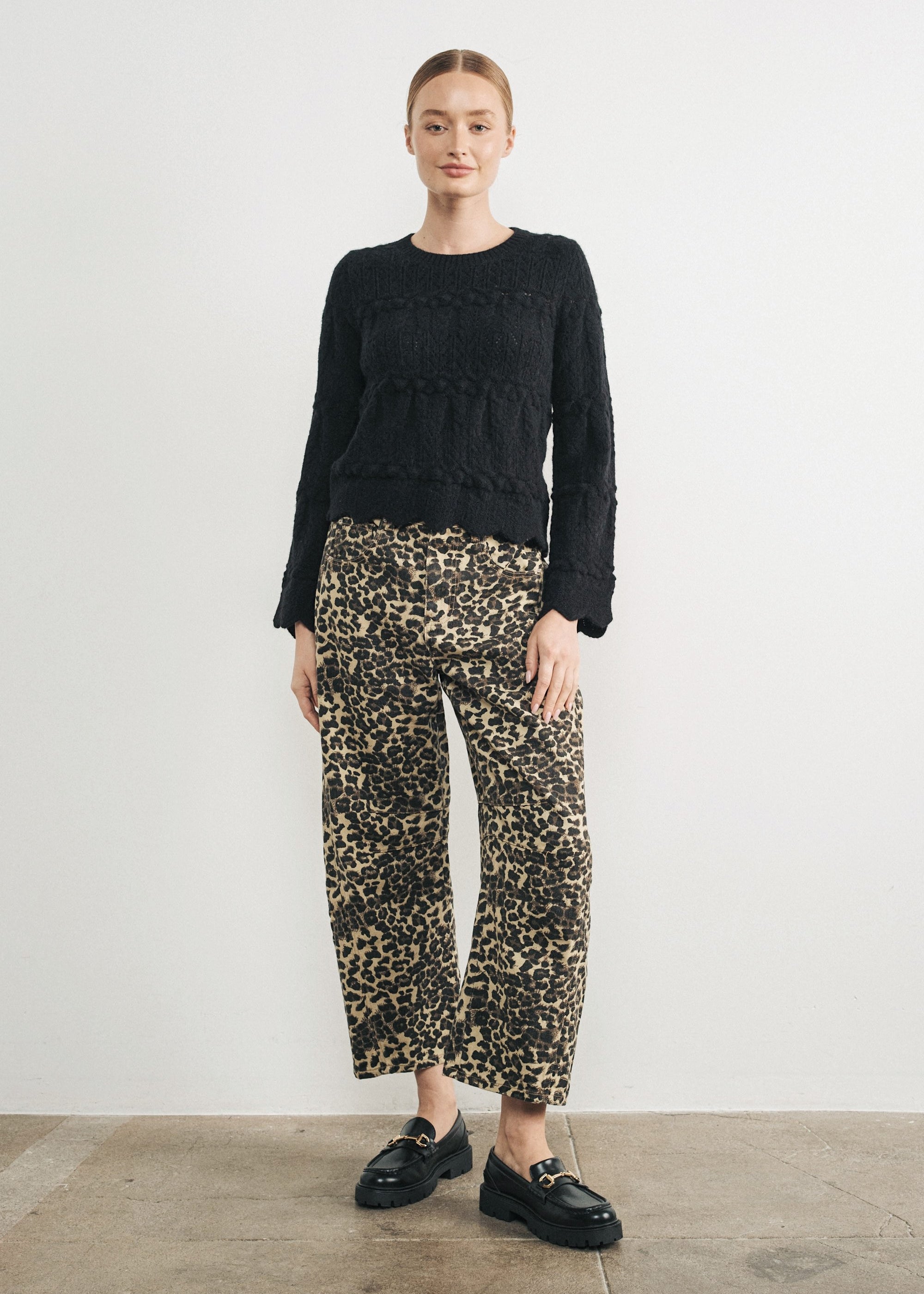 Woman wearing Good Luck Barrel Jeans in Leopard and black sweater - front view