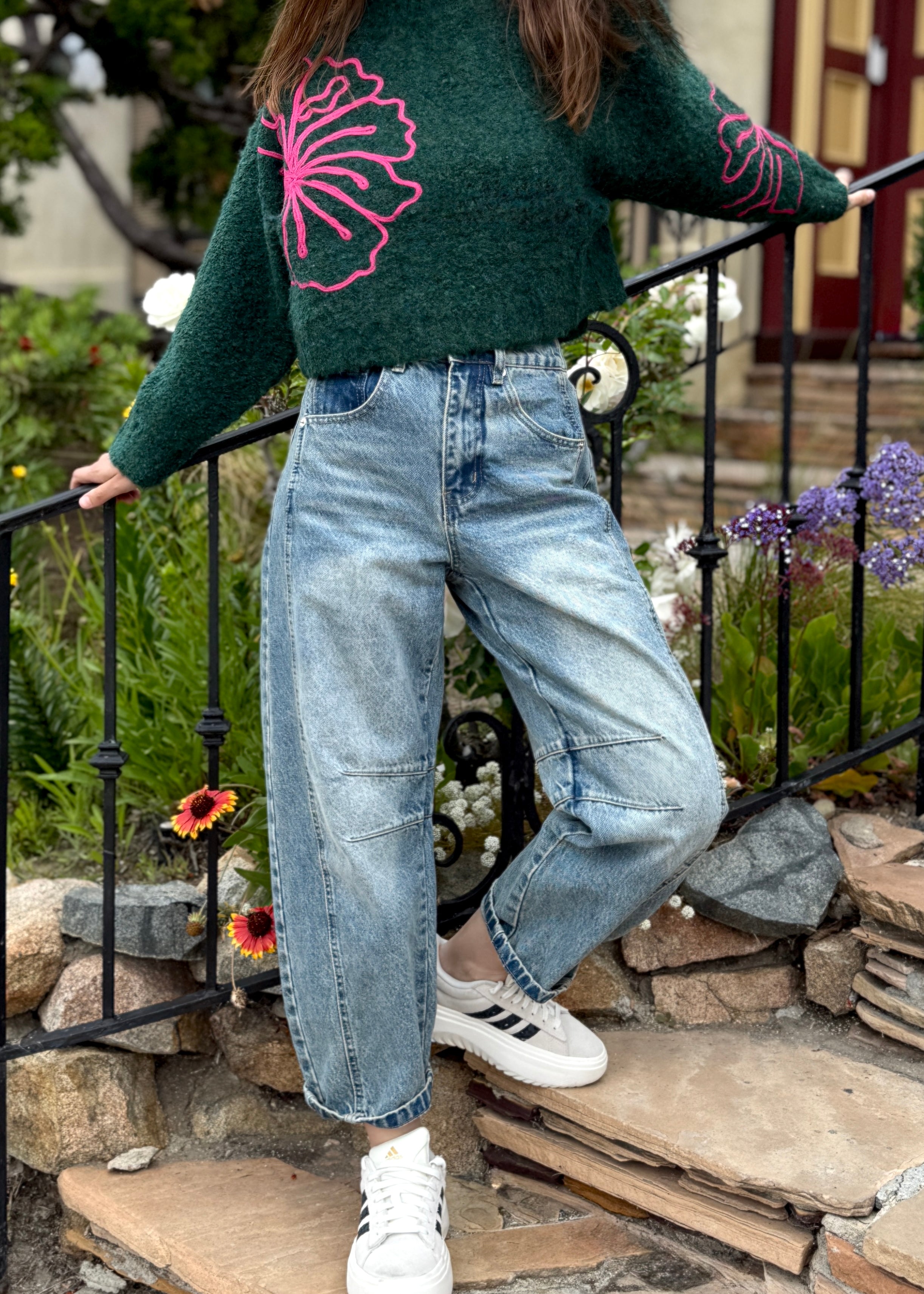 Outdoor image of woman is wearing  Good Luck Barrel Jeans in Washed Denim - front view