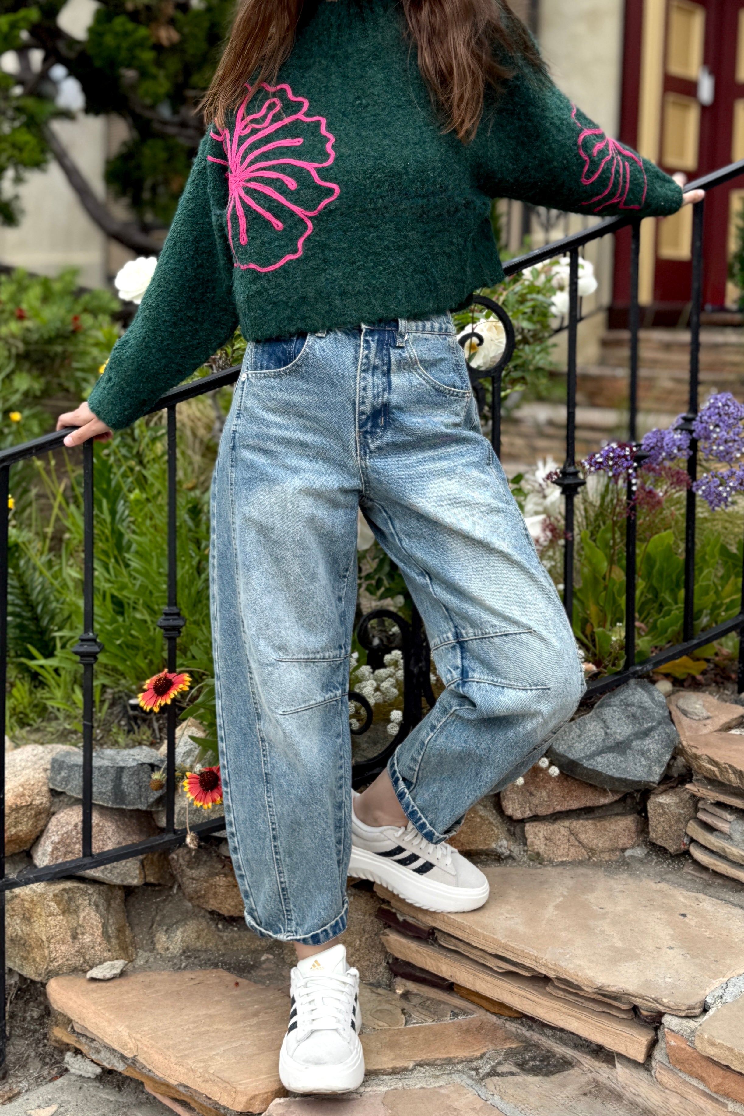 Outdoor image of woman is wearing  Good Luck Barrel Jeans in Washed Denim - front view