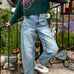 Outdoor image of woman is wearing  Good Luck Barrel Jeans in Washed Denim - front view