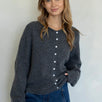 Woman wearing Hailey Button Down Cardigan Charcoal  - front view women's sweater