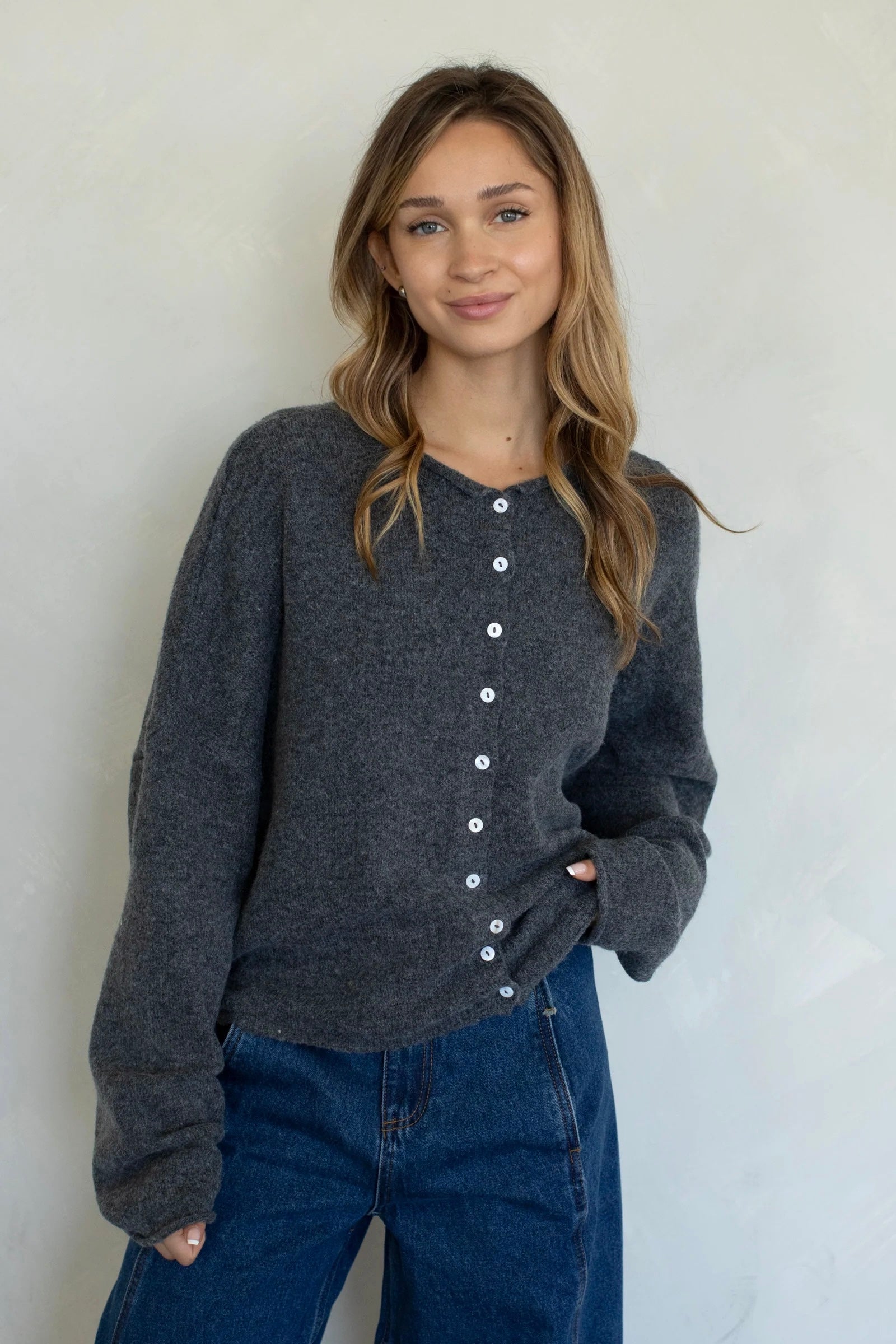 Woman wearing Hailey Button Down Cardigan Charcoal  - front view women's sweater