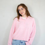model is wearing Hailey button down cardigan (piper cardigan) in baby pink - front view