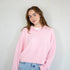 model is wearing Hailey button down cardigan (piper cardigan) in baby pink - front view