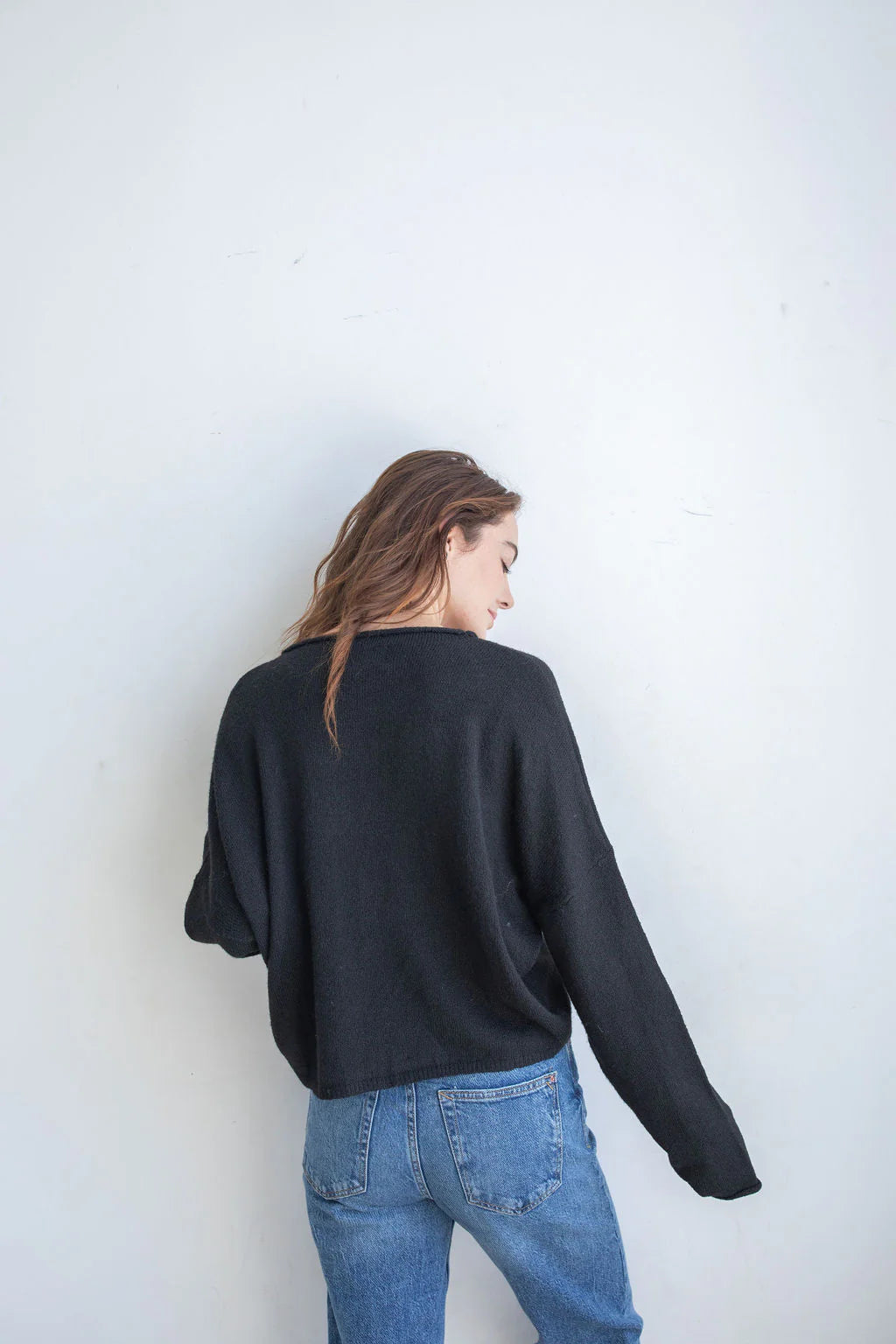 Black Hailey Button Down Cardigan front view, soft lightweight knit cardigan with button front and relaxed rolled edges - back view