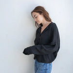Black Hailey Button Down Cardigan front view, soft lightweight knit cardigan with button front and relaxed rolled edges - side view