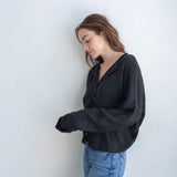 Black Hailey Button Down Cardigan front view, soft lightweight knit cardigan with button front and relaxed rolled edges - side view