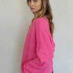 Model is wearing Hailey Button Down Cardigan in Bubblegum - side view