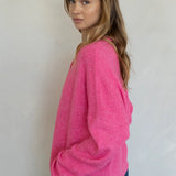 Model is wearing Hailey Button Down Cardigan in Bubblegum - side view