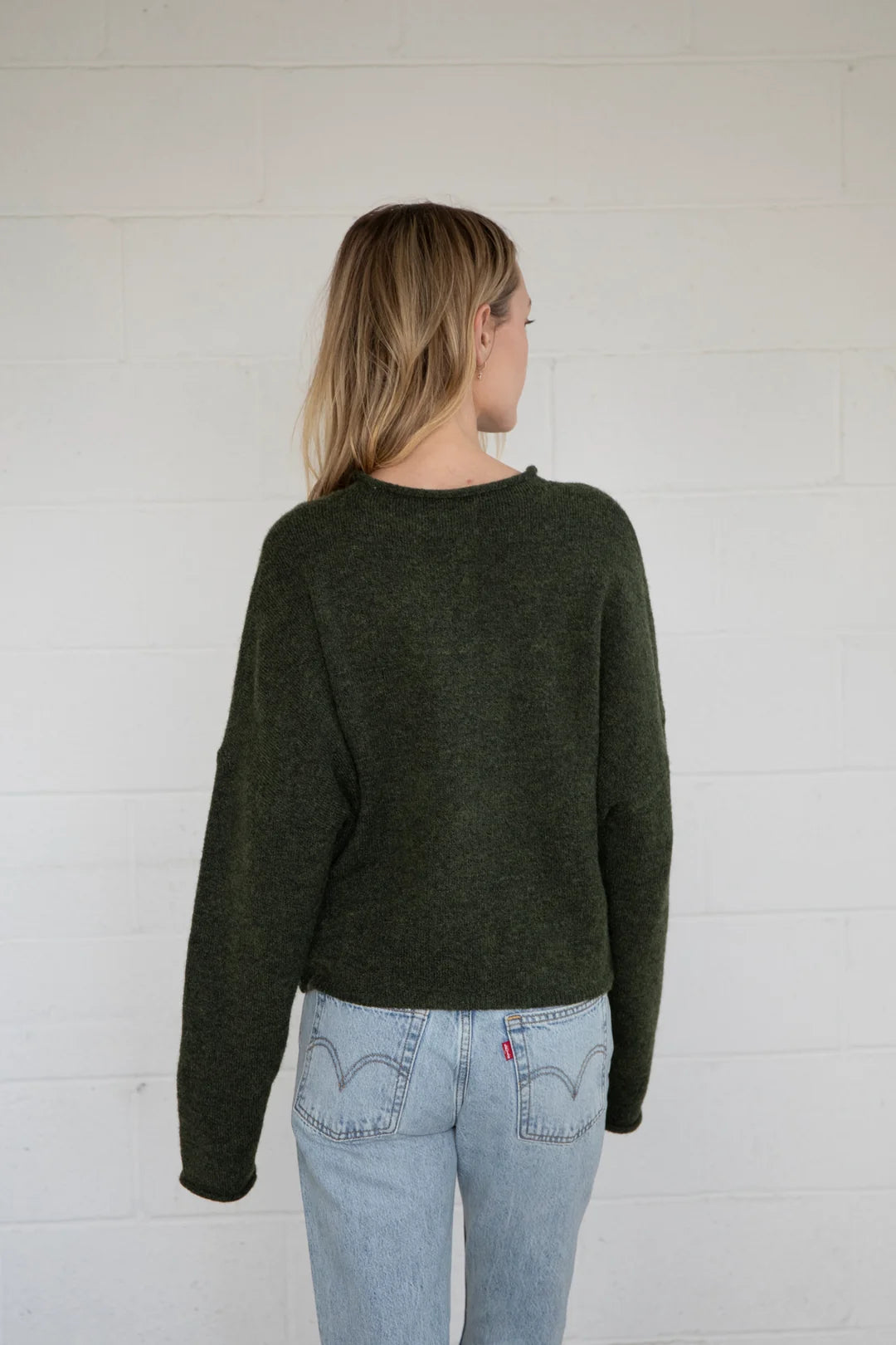 Back view of Things Between Piper Cardigan in hunter green