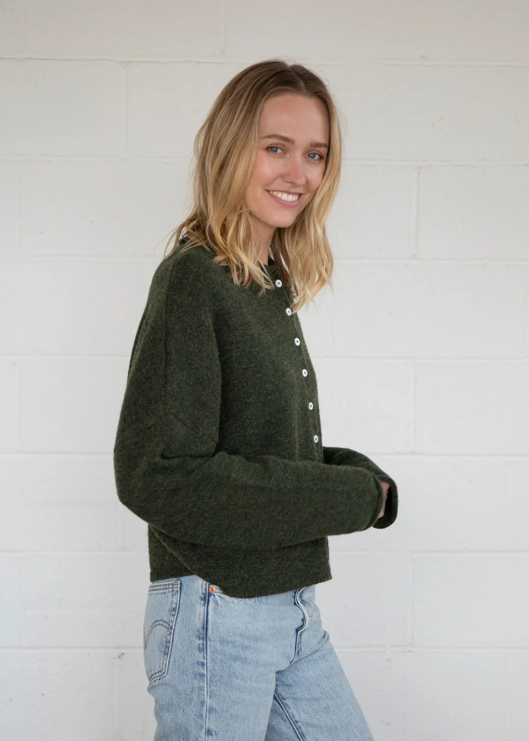 Side view of Things Between Piper Cardigan in hunter green