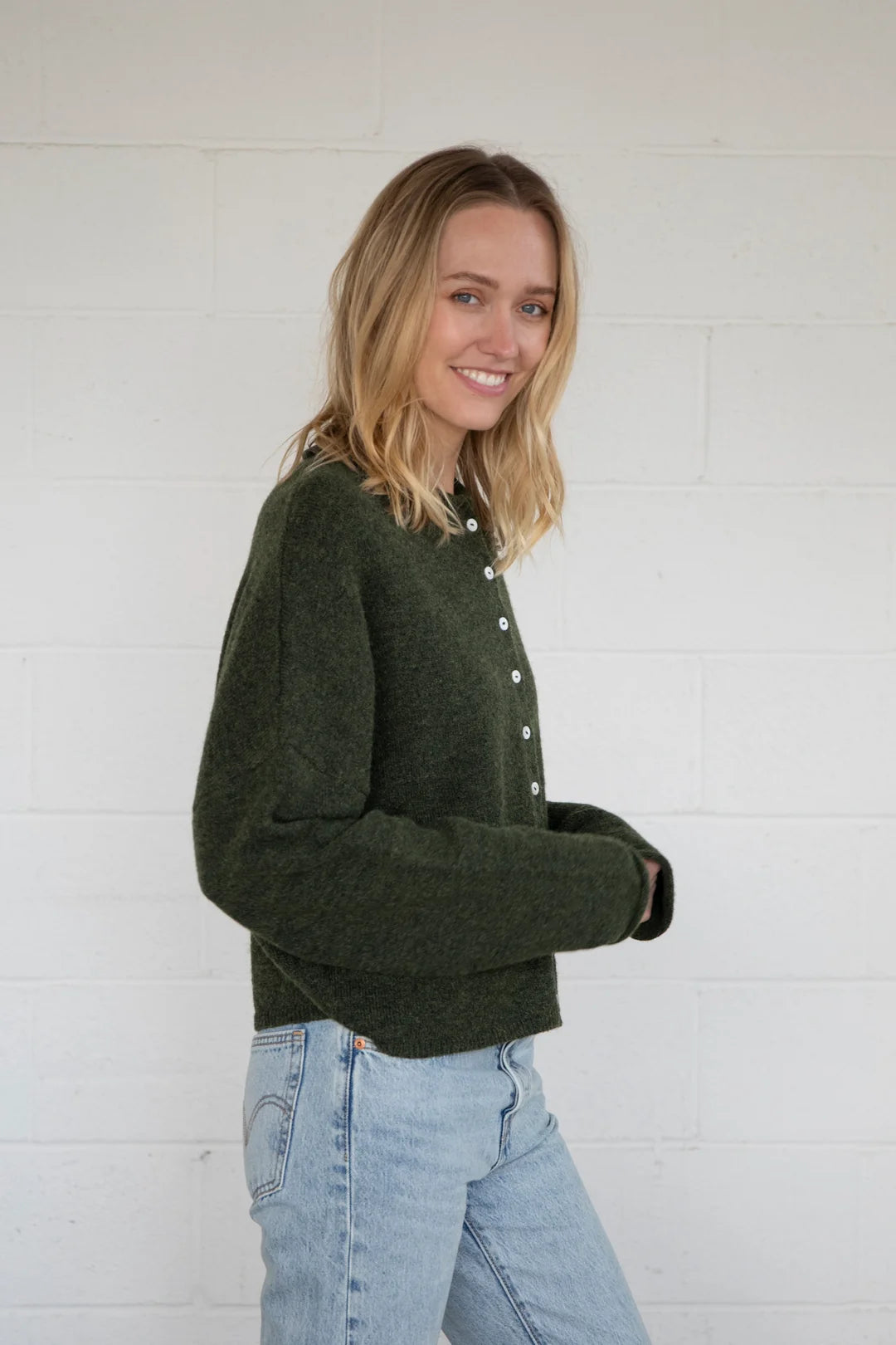 Side view of Things Between Piper Cardigan in hunter green