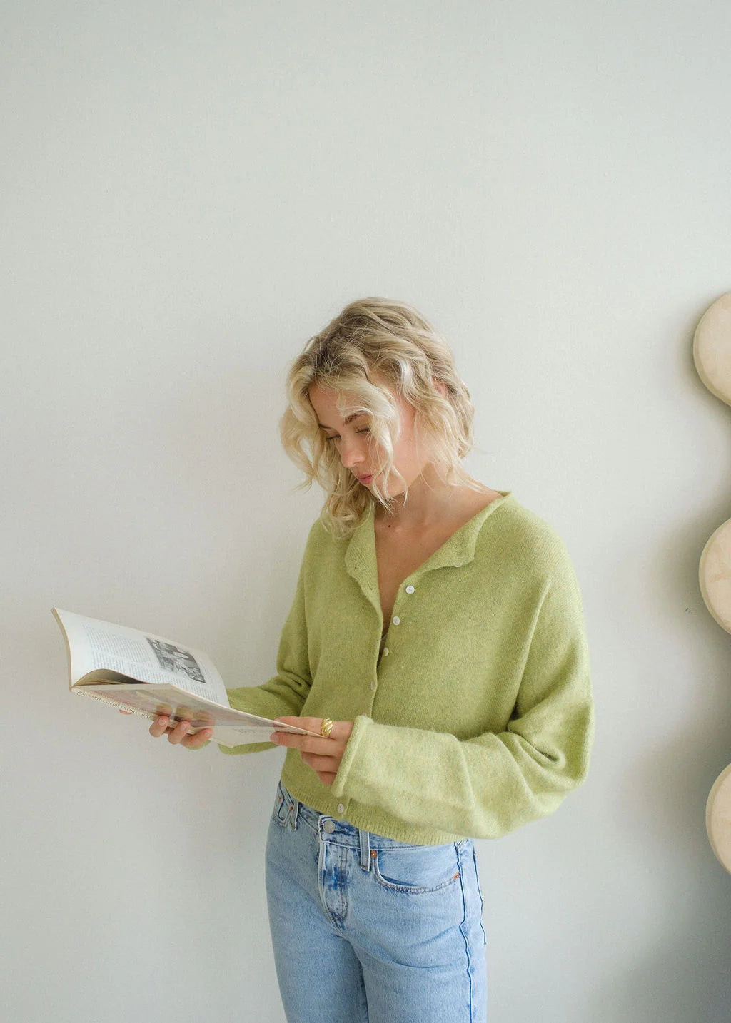 model is wearing Hailey Button Down Cardigan (Piper Cardigan) in Lemongrass 