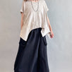 Woman is wearing Trinity Flowy Oversized Top in beige - front view