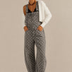 Aaron & Amber barrel-leg denim overalls in washed black with white polka dots, front view