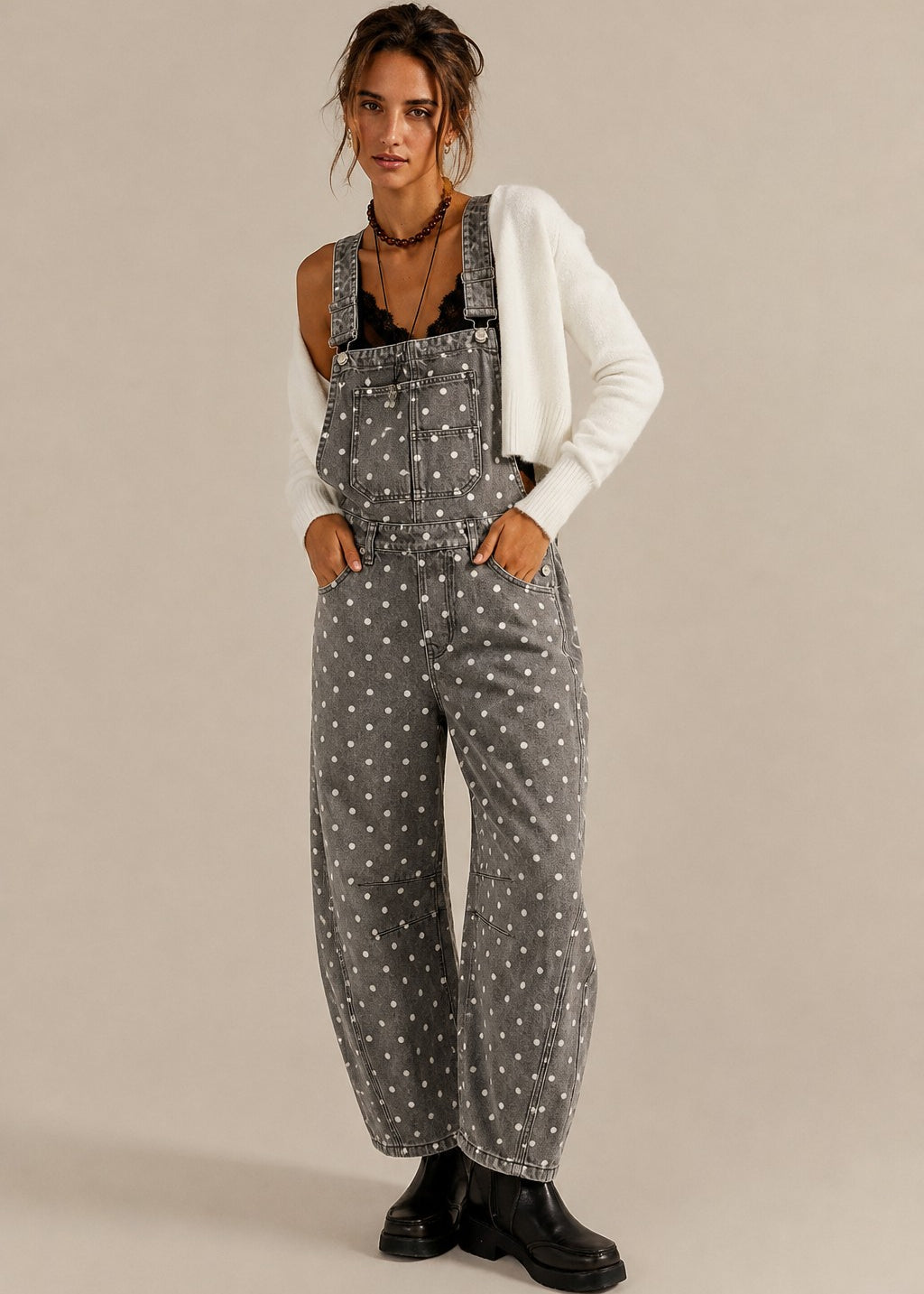 Aaron & Amber barrel-leg denim overalls in washed black with white polka dots, front view