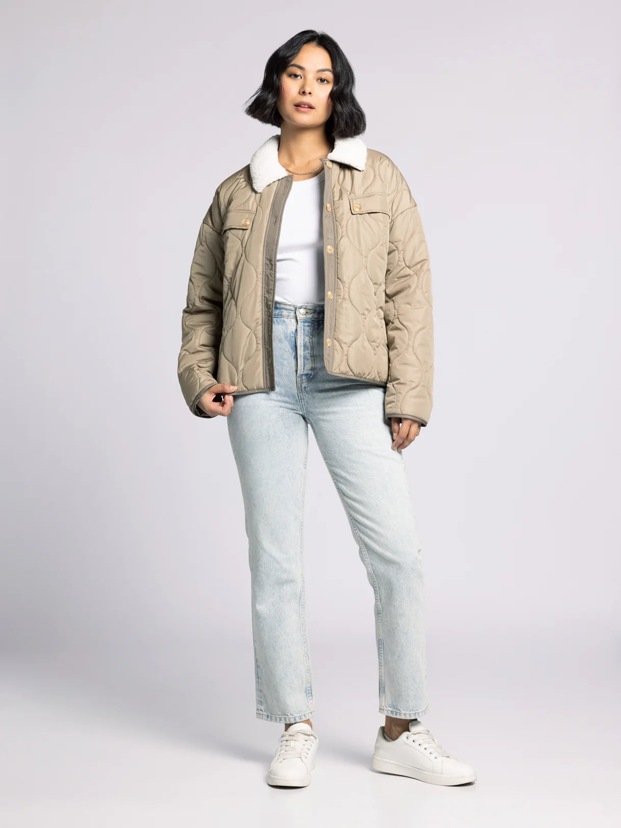 Side view of olive Aura Quilted Puffer Coat with sherpa collar and relaxed fit — stylish women’s winter coat.