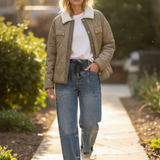 Olive quilted puffer coat with sherpa collar styled over knit top and jeans — cozy women’s fall outfit.