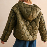 Back view of the Ava Hooded Quilted Puffer Jacket in olive showing quilted pattern and hood