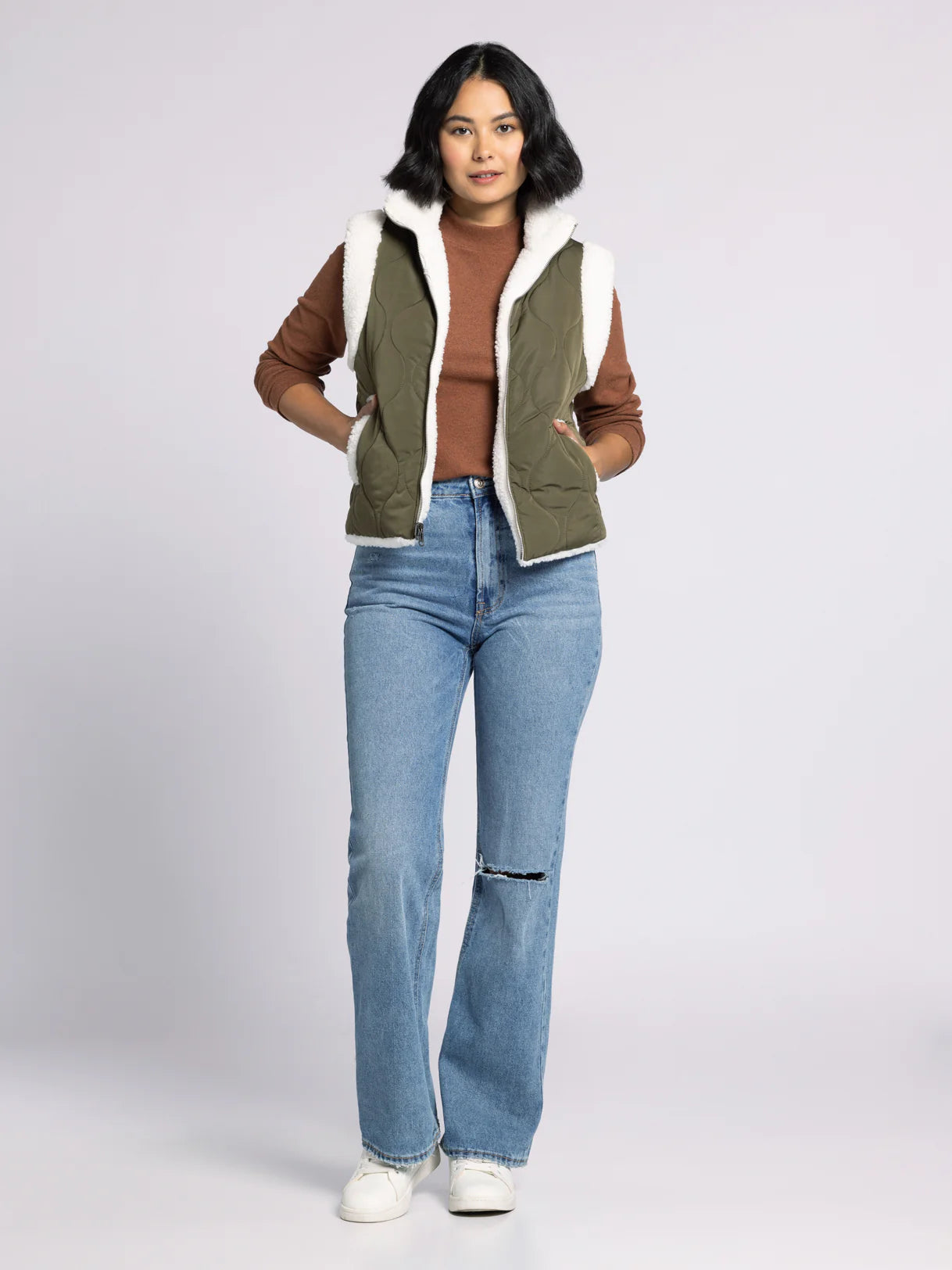 Ava Reversible Sherpa Quilted Vest by Dani West styled with jeans and sweater — cozy women’s layering outfit.