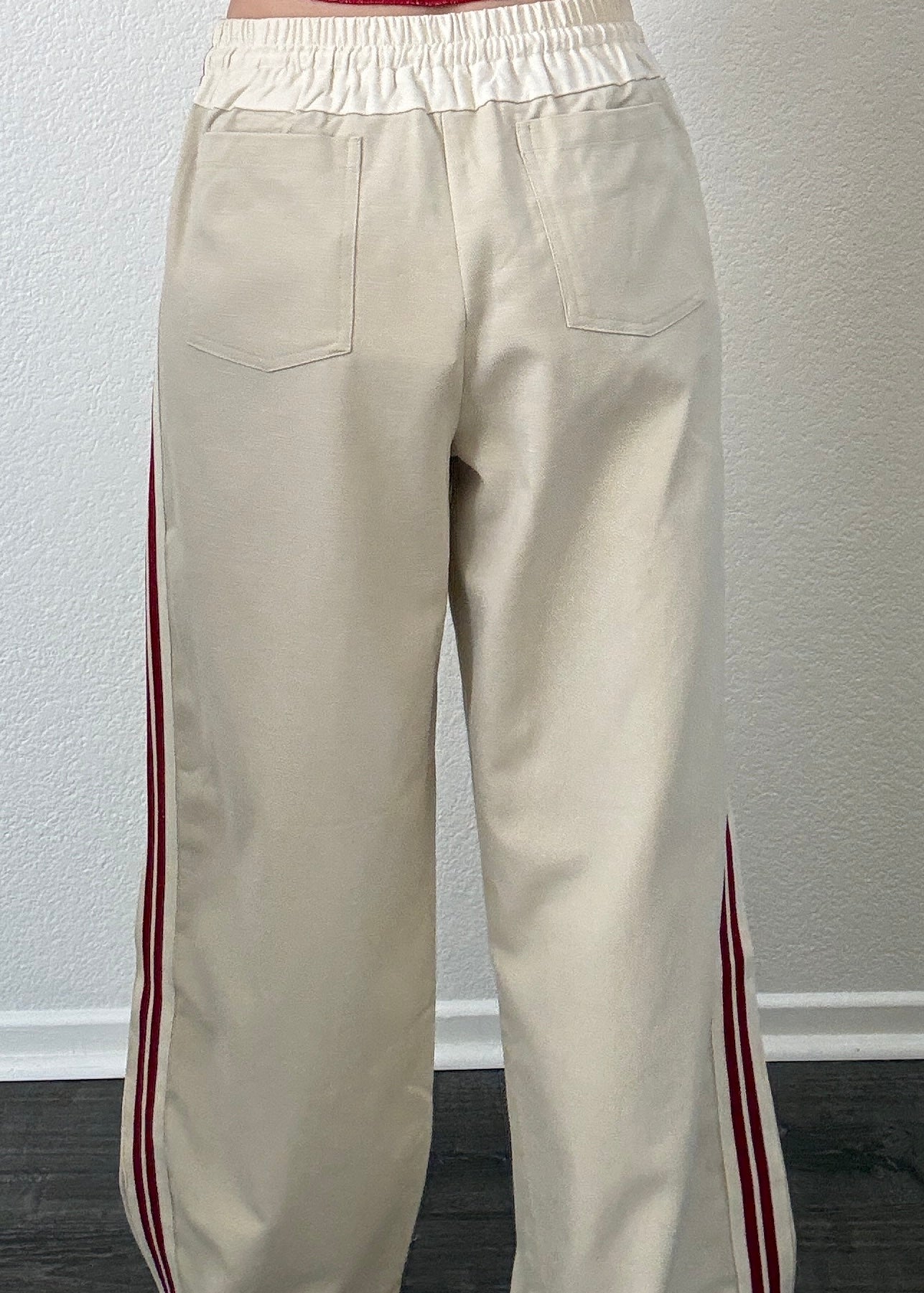 The Brooklin wide-leg pull-on pants in beige, back view with elastic waistband and patch pockets
