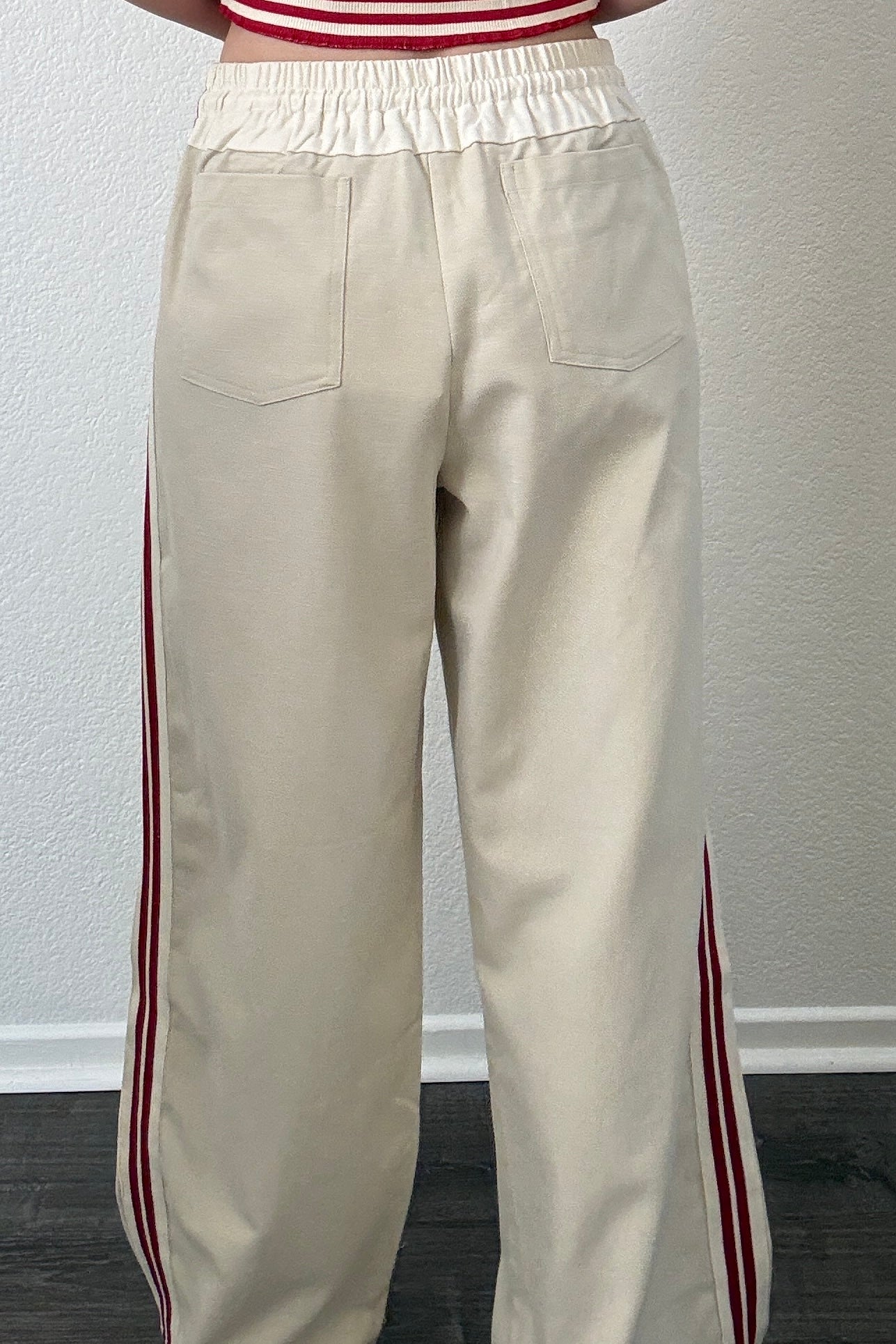 The Brooklin wide-leg pull-on pants in beige, back view with elastic waistband and patch pockets