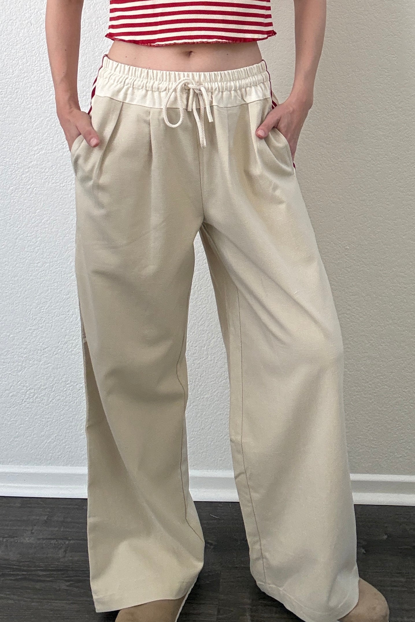 The Brooklin side-stripe pull-on wide-leg pants in beige, front view with elastic waist and tie detail