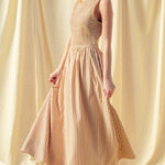 Full length brown striped smocked maxi dress with flowing skirt