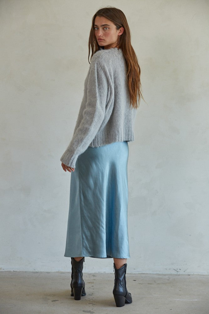 Side view of Carly fuzzy knit pullover sweater showing relaxed silhouette