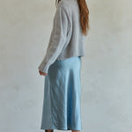 Side view of Carly fuzzy knit pullover sweater showing relaxed silhouette