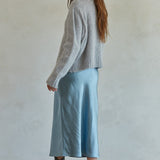 Side view of Carly fuzzy knit pullover sweater showing relaxed silhouette