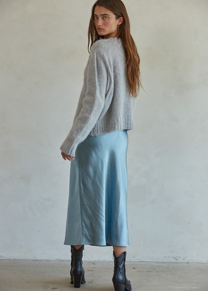 Side view of Carly fuzzy knit pullover sweater showing relaxed silhouette