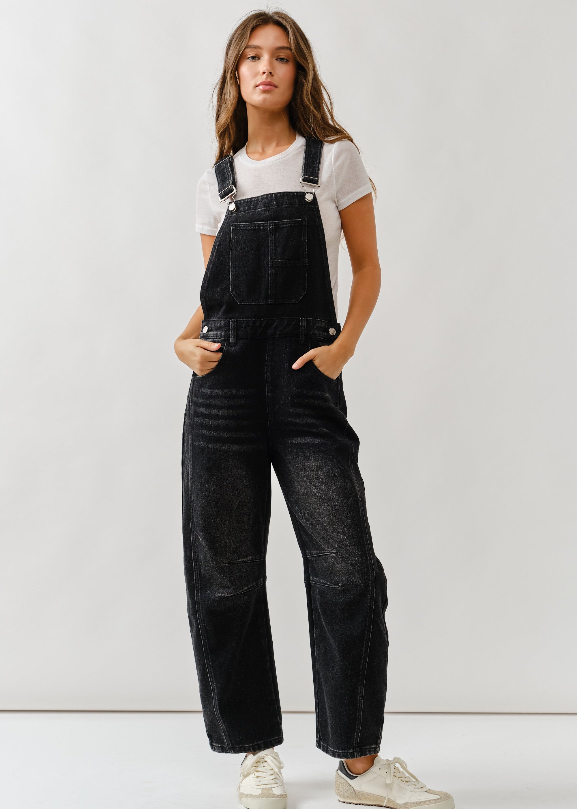 Chill denim overall in black wash with slouchy relaxed fit and adjustable straps