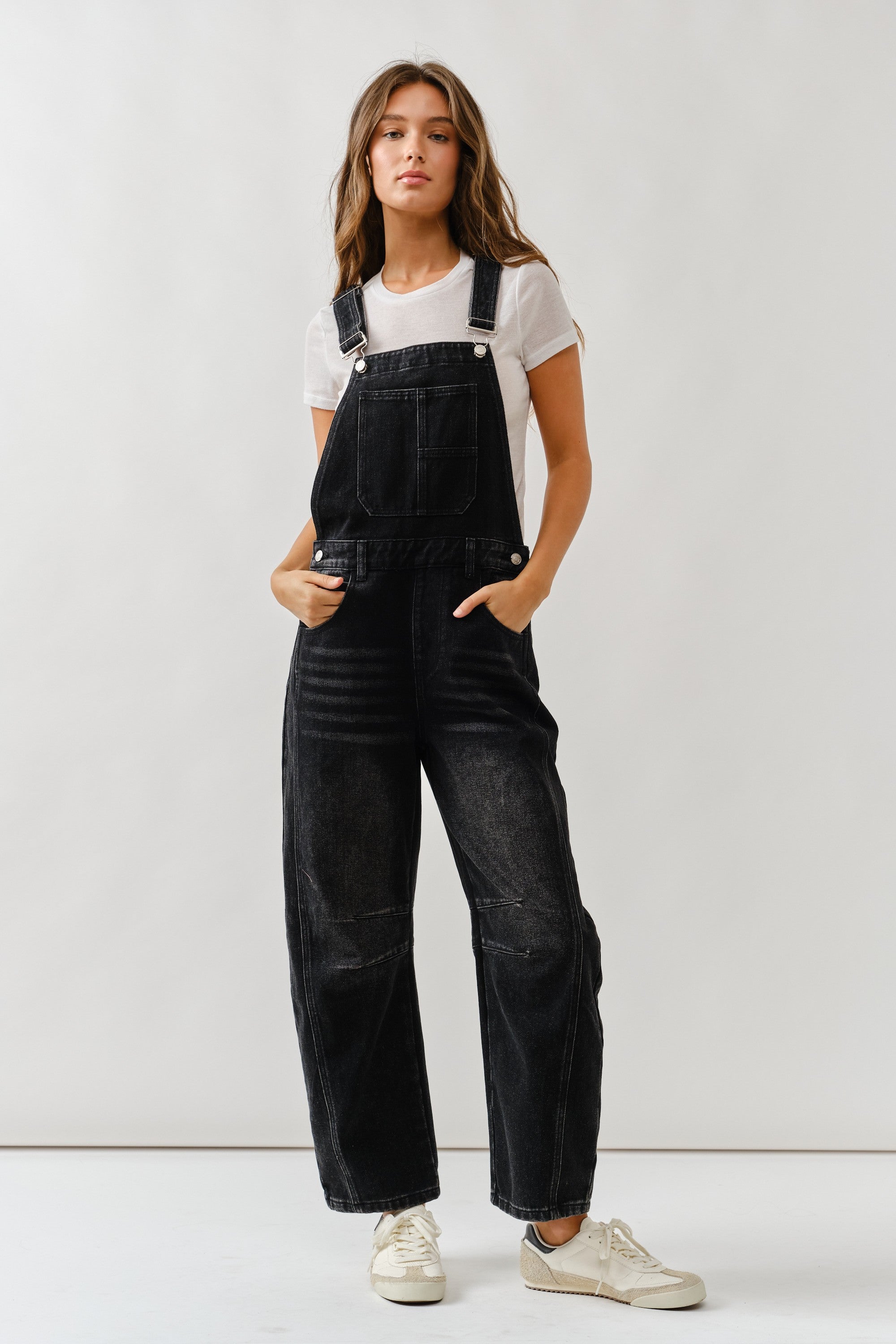 Chill denim overall in black wash with slouchy relaxed fit and adjustable straps