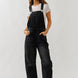 Chill denim overall in black wash with slouchy relaxed fit and adjustable straps