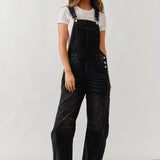 Full body view of chill denim overall in black wash styled casually