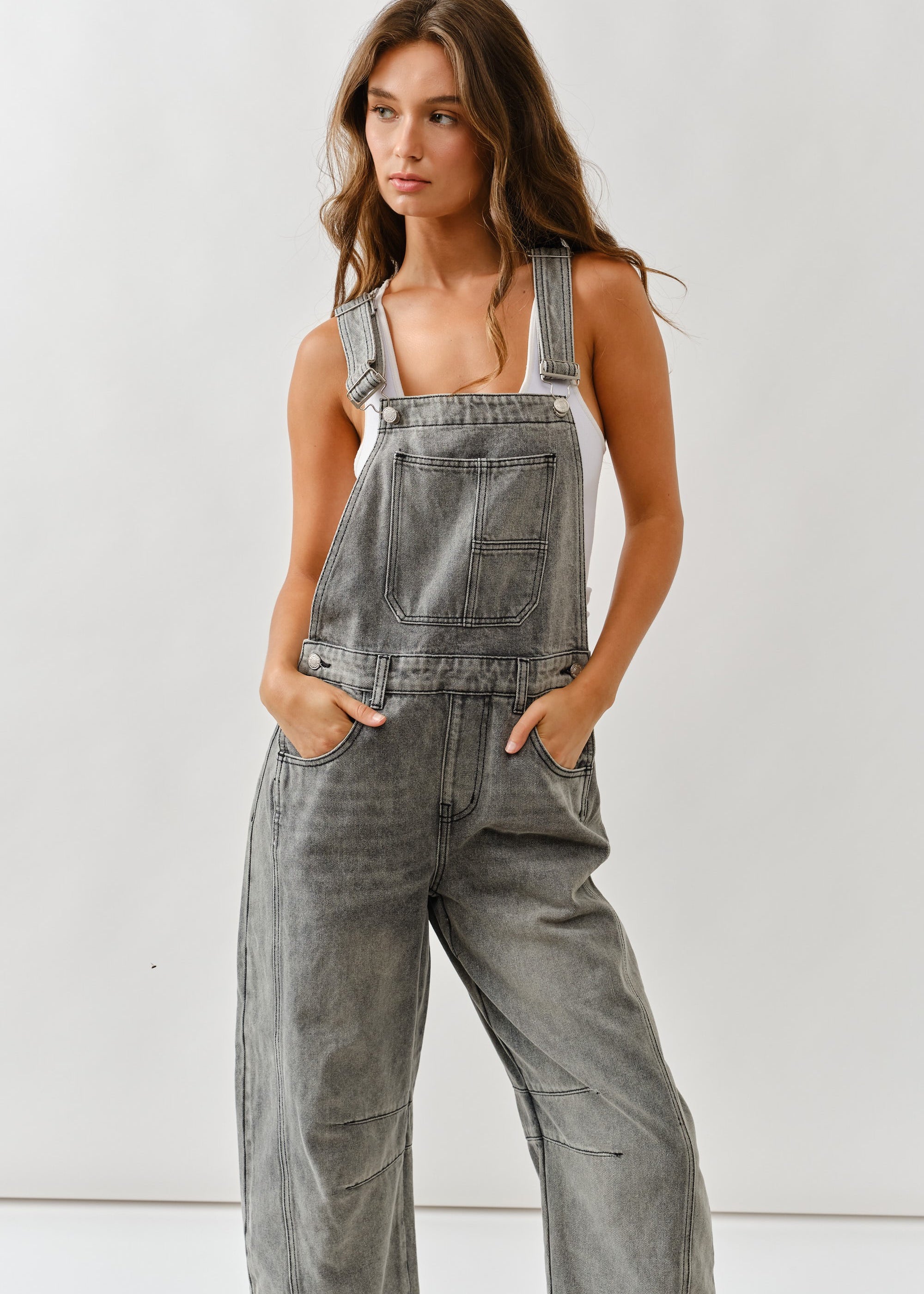 Angled front view of chill denim overall in grey wash for casual everyday wear