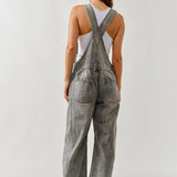 Back view of chill denim overall in grey wash with adjustable straps
