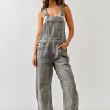 Full body front view of chill denim overall in grey wash with barrel-fit legs