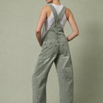 Chill Denim Overall in olive, back view showing the slouchy relaxed fit, back pockets, and full-length barrel legs.