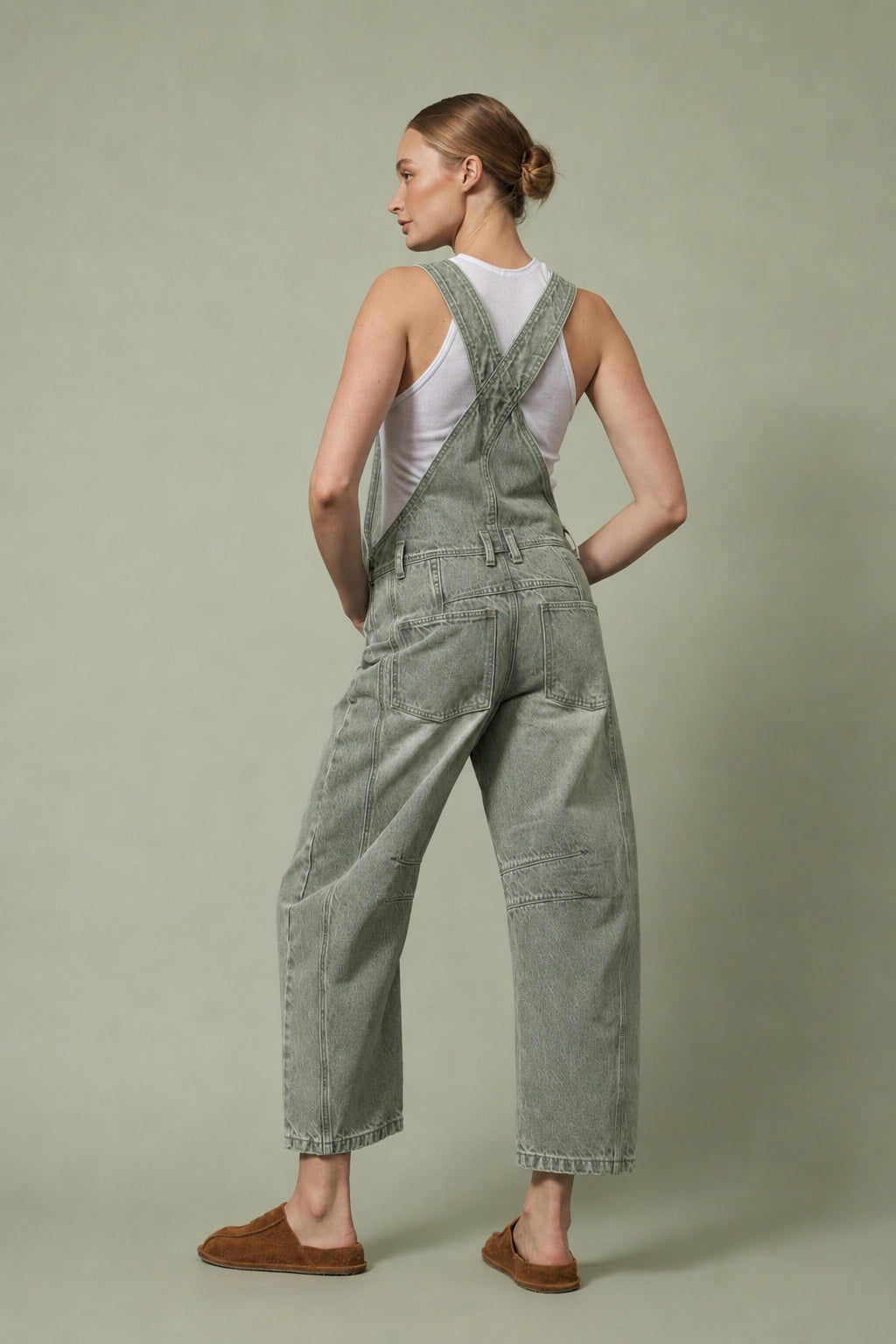 Chill Denim Overall in olive, back view showing the slouchy relaxed fit, back pockets, and full-length barrel legs.